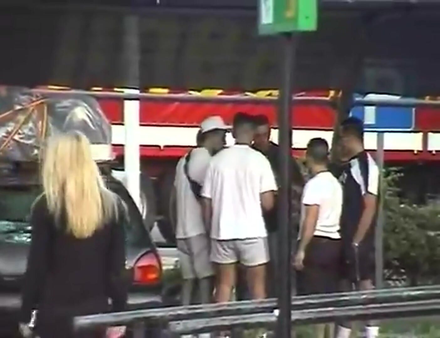 Kelly asking a group of guys if they want a blowjob