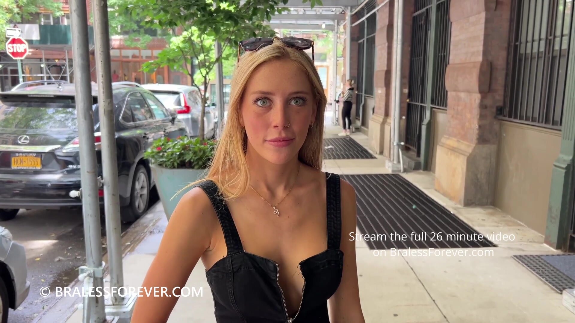 Unzipping and showing off her amazing body in public