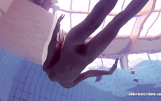 Slim Russian girl Lucy Gurchenko swims naked in underwater show